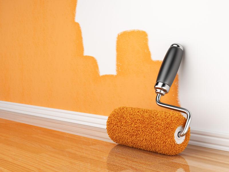 一堵空墙上的三维翻新家园的橙色油漆