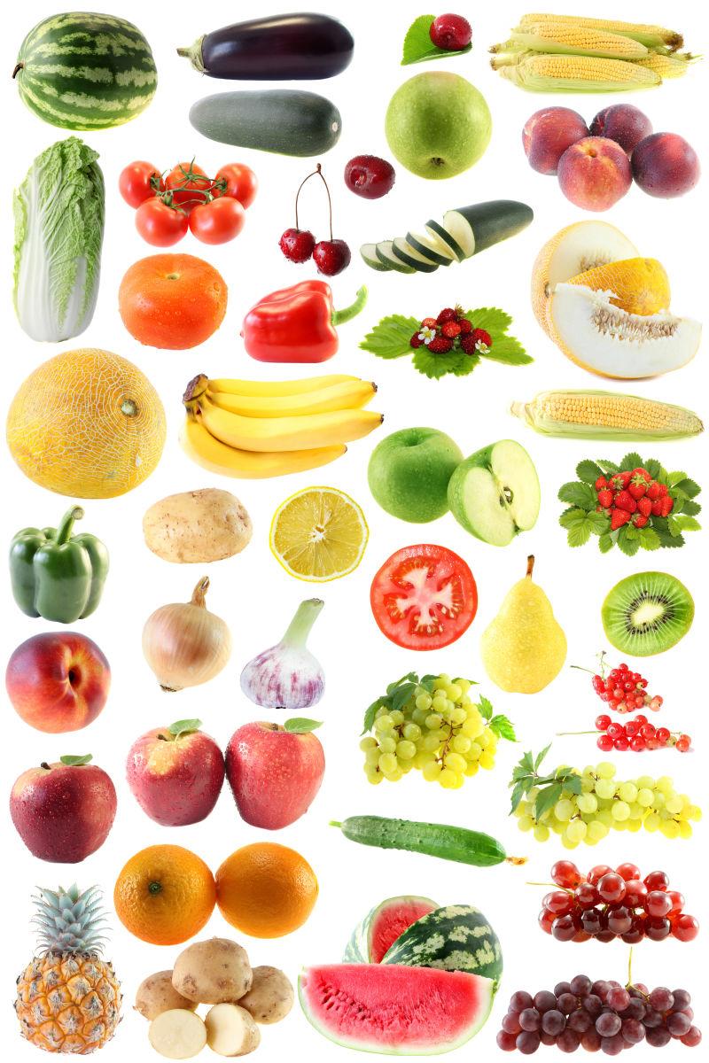 白色背景上一边的许多品种的水果蔬菜