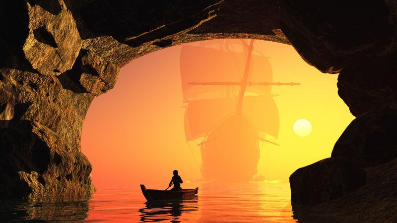 日落时分山洞里的帆船剪影