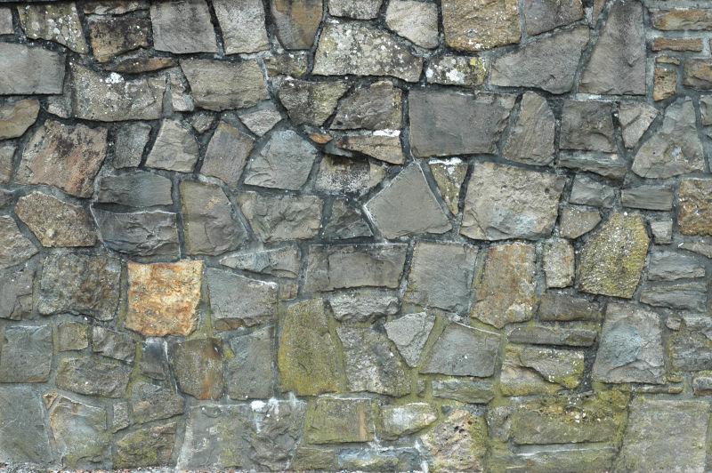不规则的石头墙的背景
