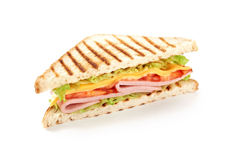 夹火腿奶酪西红柿生菜和烤面包的三明治上图为白底独立视图