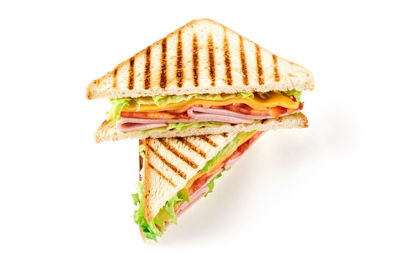 夹火腿奶酪西红柿生菜和烤面包的三明治白色背景上的顶视图