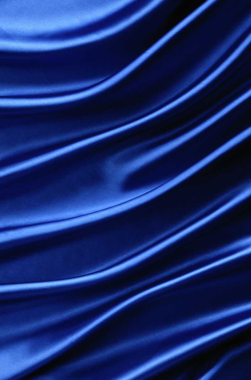 带有曲线的蓝色丝绸背景-垂直