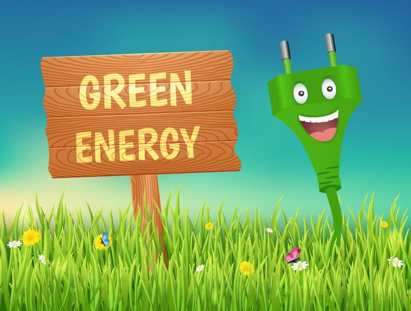 绿色能源概念-草地上的微笑插头