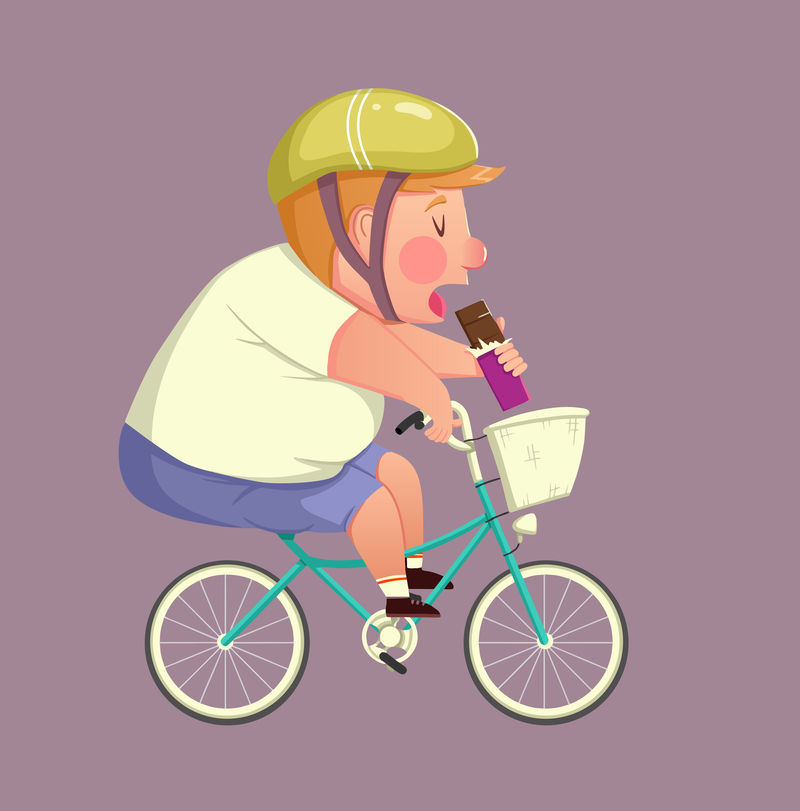 有趣的胖男孩骑自行车吃巧克力