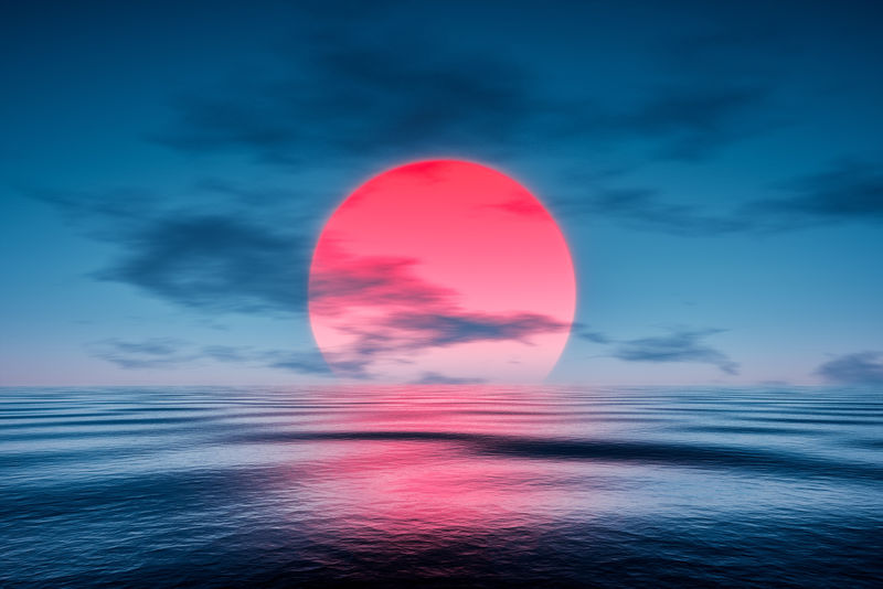 蓝色海面上的红色日落