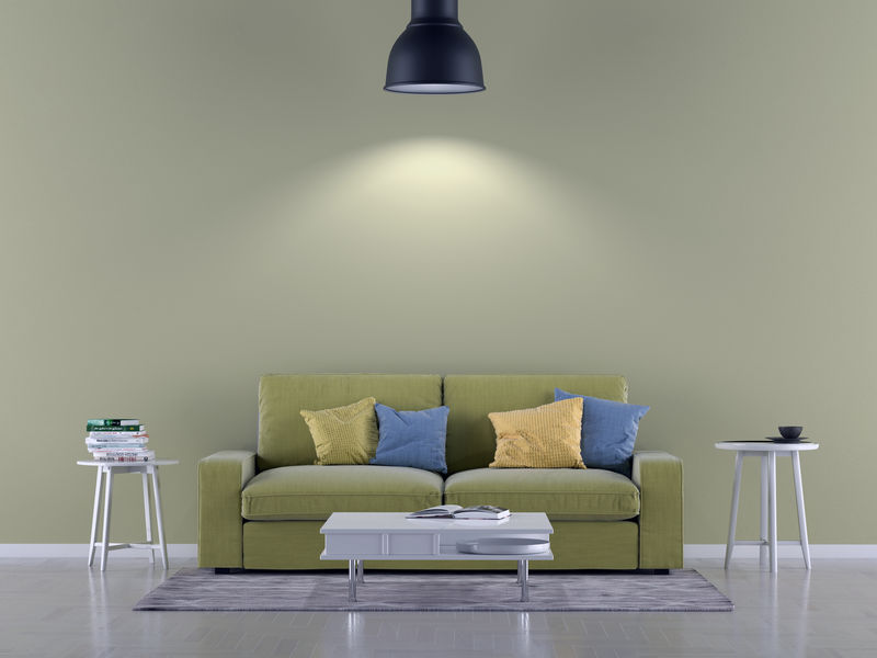 空房间的绿色沙发-背景是灯和墙