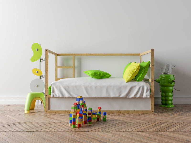 空荡荡的儿童房，有一张木制的小床和一堵白色的墙