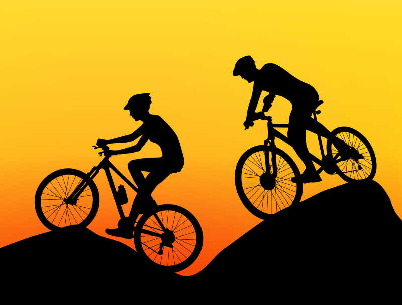山坡上的自行车运动员剪影矢量插画