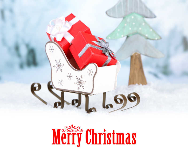 圣诞主题背景上的装着礼物的玩具雪橇
