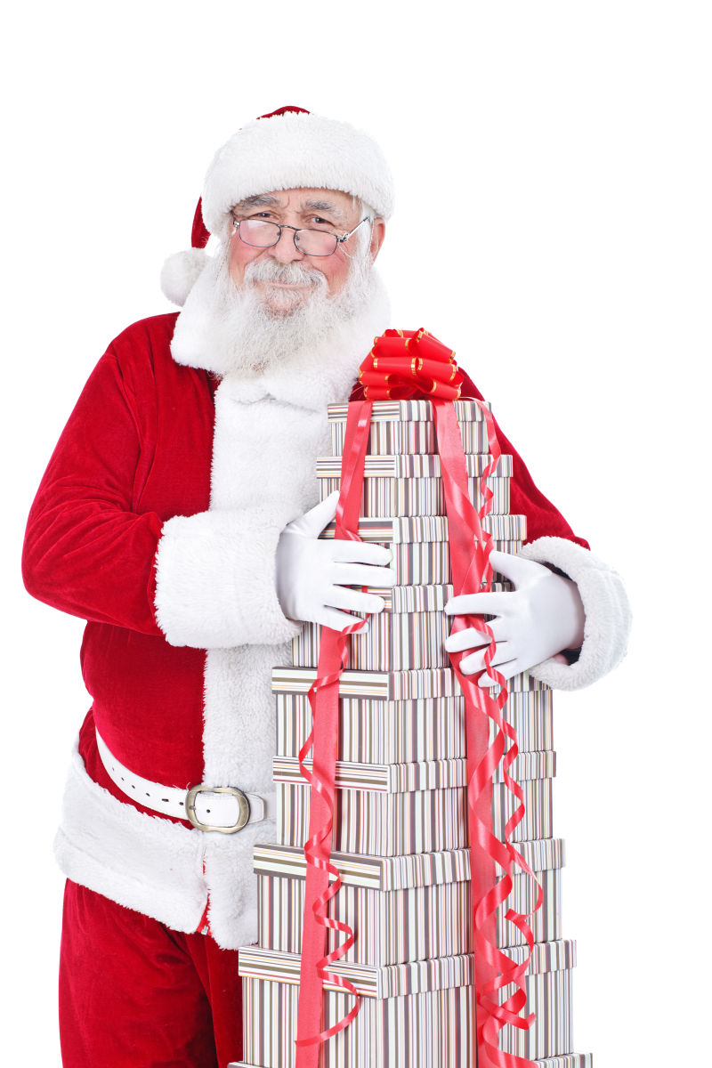 圣诞老人微笑抱着一堆礼品盒