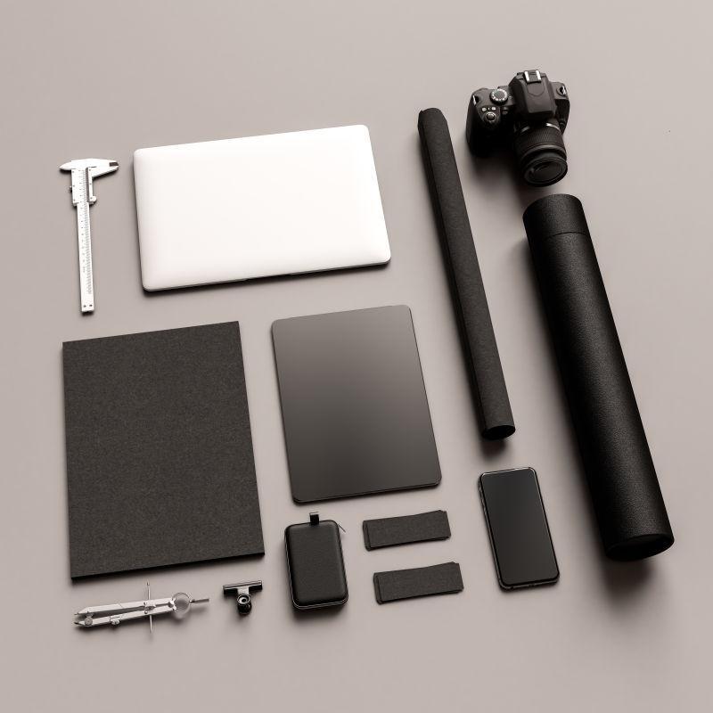 灰色办公桌上的黑色和白色的文具模型